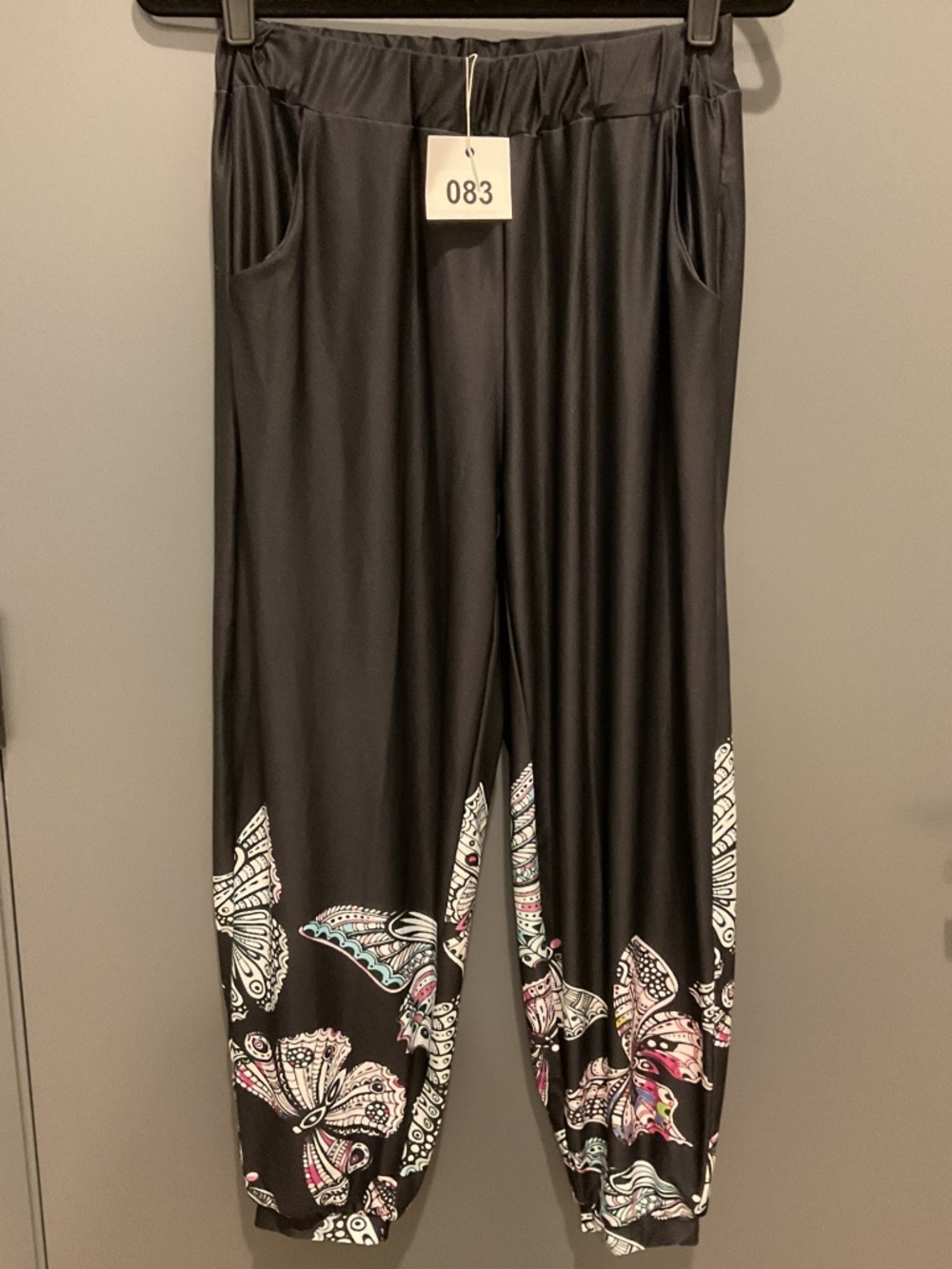 Black pants with butterflies design
